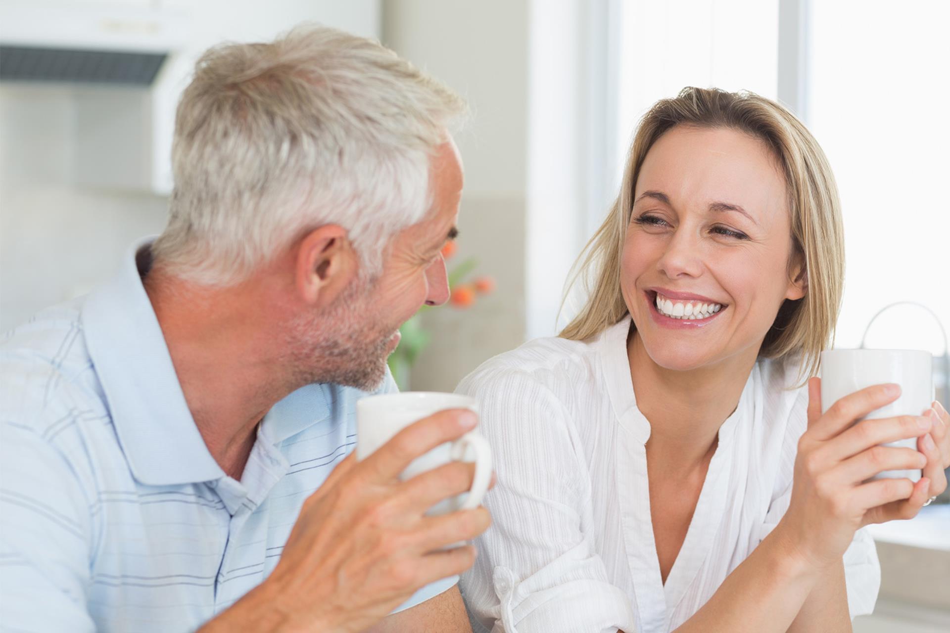 happy mature couple drinking coffee